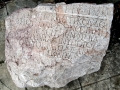 Hand carved ancient Cyrillic writing in marble stone at Villa Marija