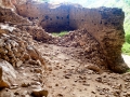 Medieval fortress at the opening of Peshna Cave Medieval fortress at the opening of Peshna Cave